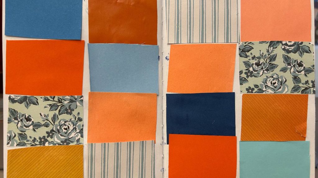 A collage of colored and patterned paper rectangles arranged in a grid