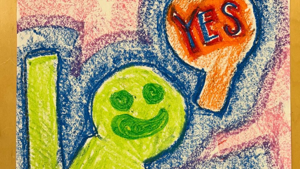 A colorful crayon drawing features a smiling green figure
